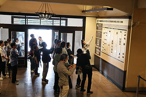 Visitors on a Main Building reception room tour