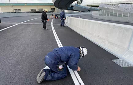 Installation of Optical Fiber within Asphalt Pavement